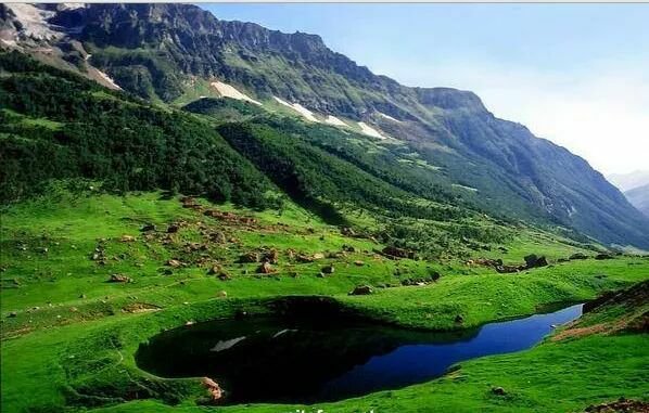 Ansoo Lake surrounded by Greenery